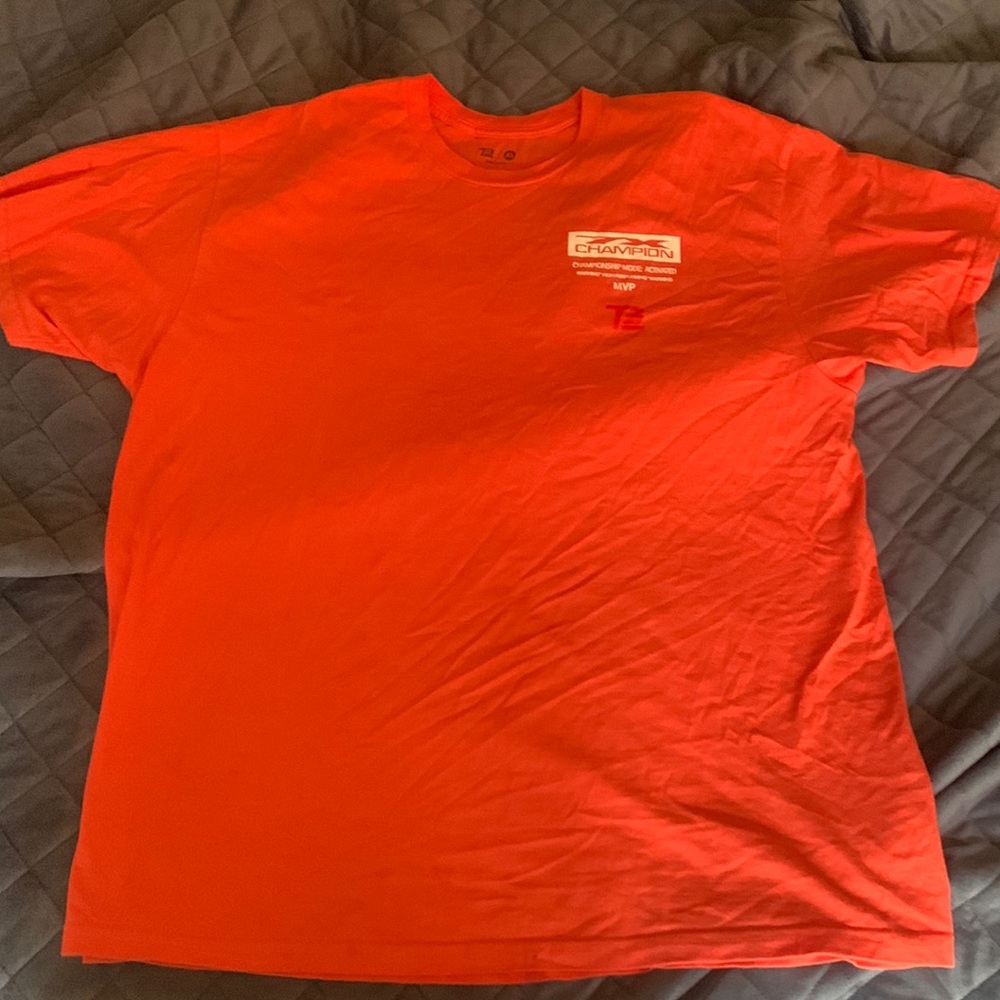 Authentic, limited sale TB12. Color of shirt is between a red and salmon pink